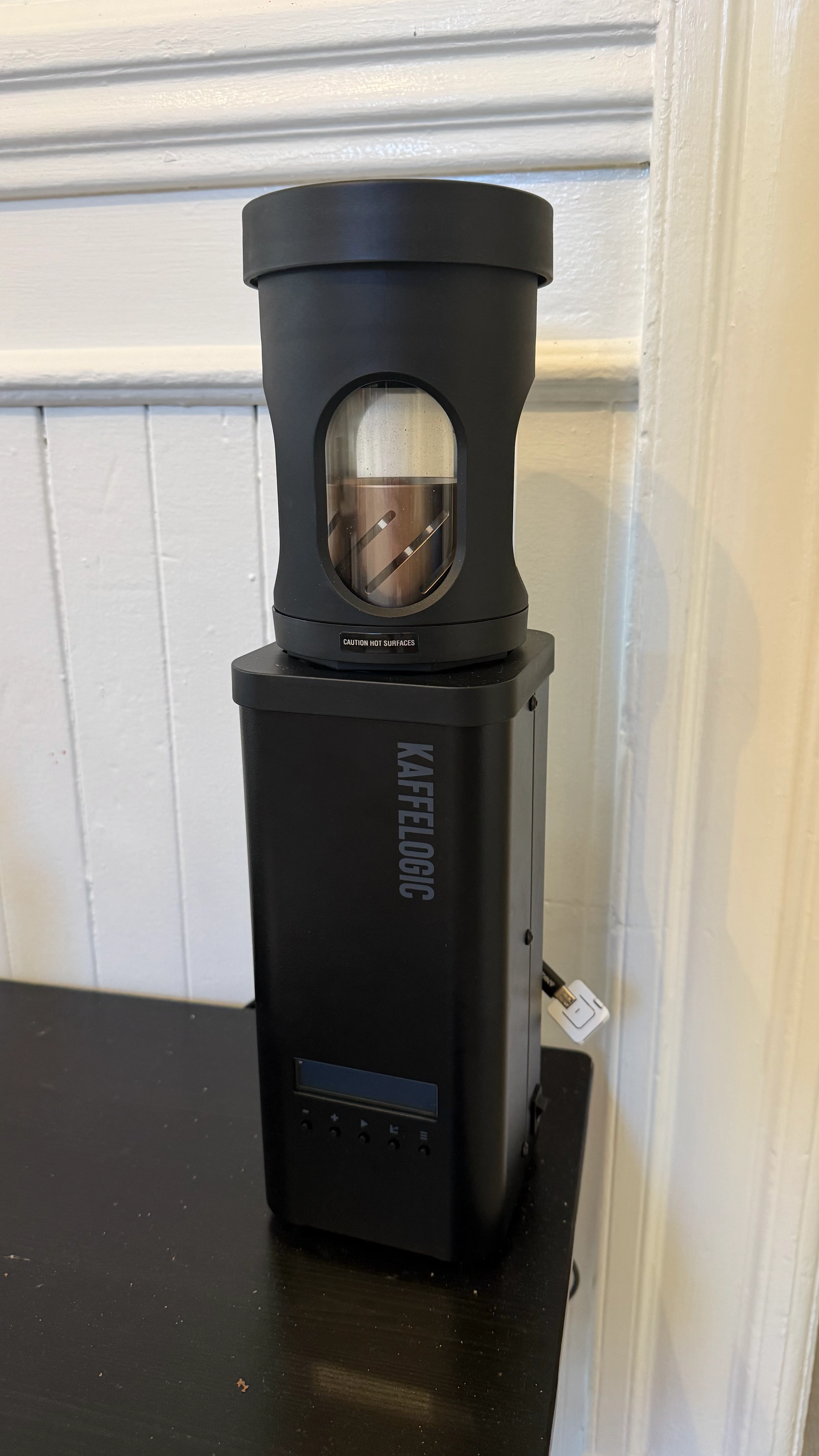 The Kaffelogic Nano roaster, with the Atom S3 bridge connected at its side.